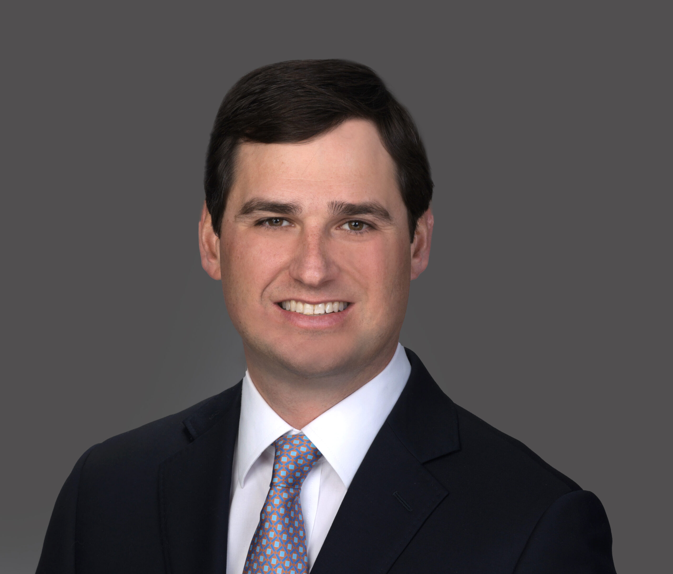 Jefferson M. Starr, Partner at Coleman Talley LLP, wearing a dark suit jacket, white dress shirt, and light-colored tie.